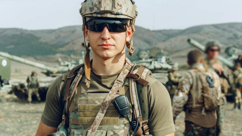 Soldier standing on polygon during military training